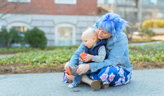 Mommy with blue hair, son in lap