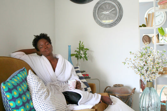 black woman relaxing in robe