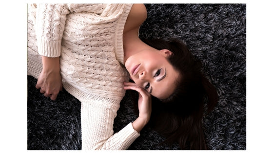 brunette woman lying down, smiling