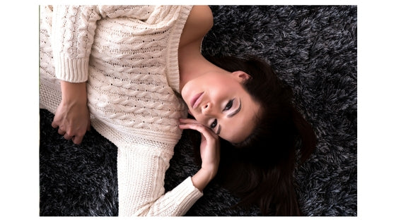 brunette woman lying down, smiling