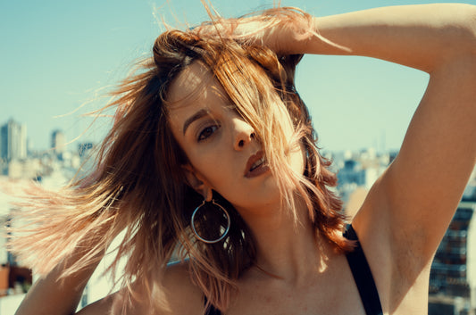 woman with hands in hair