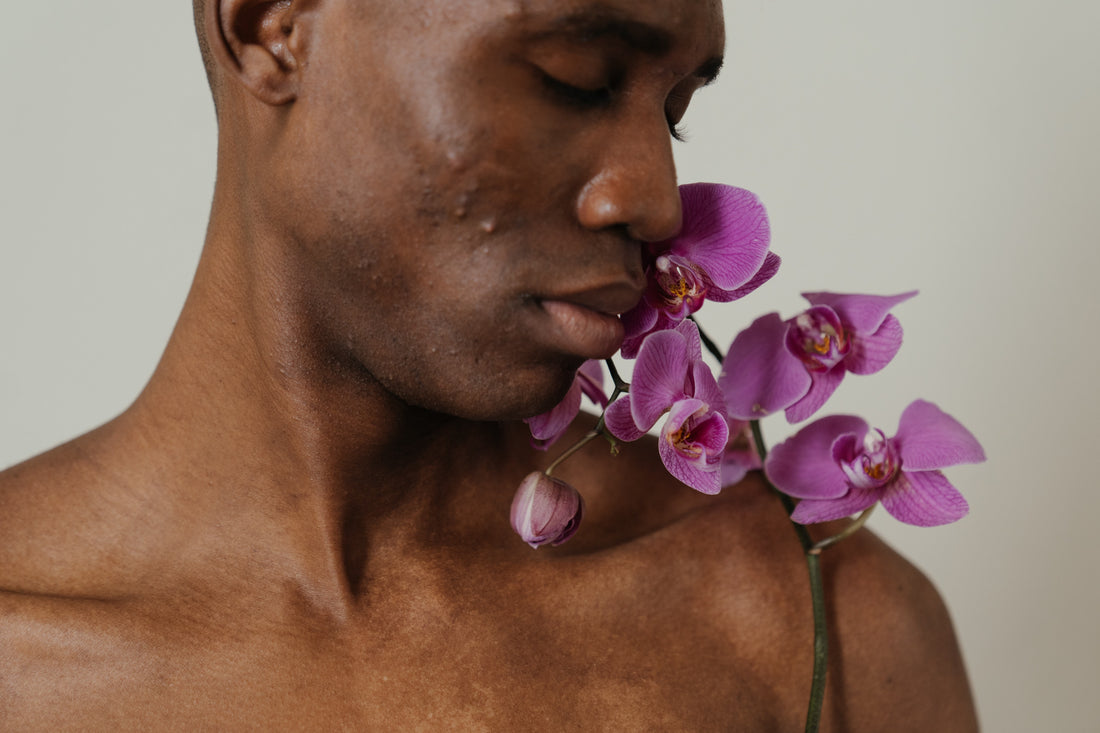 Black man, purple flowers