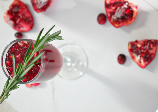 pomegranate & cranberry mimosa, with sliced pomegranate