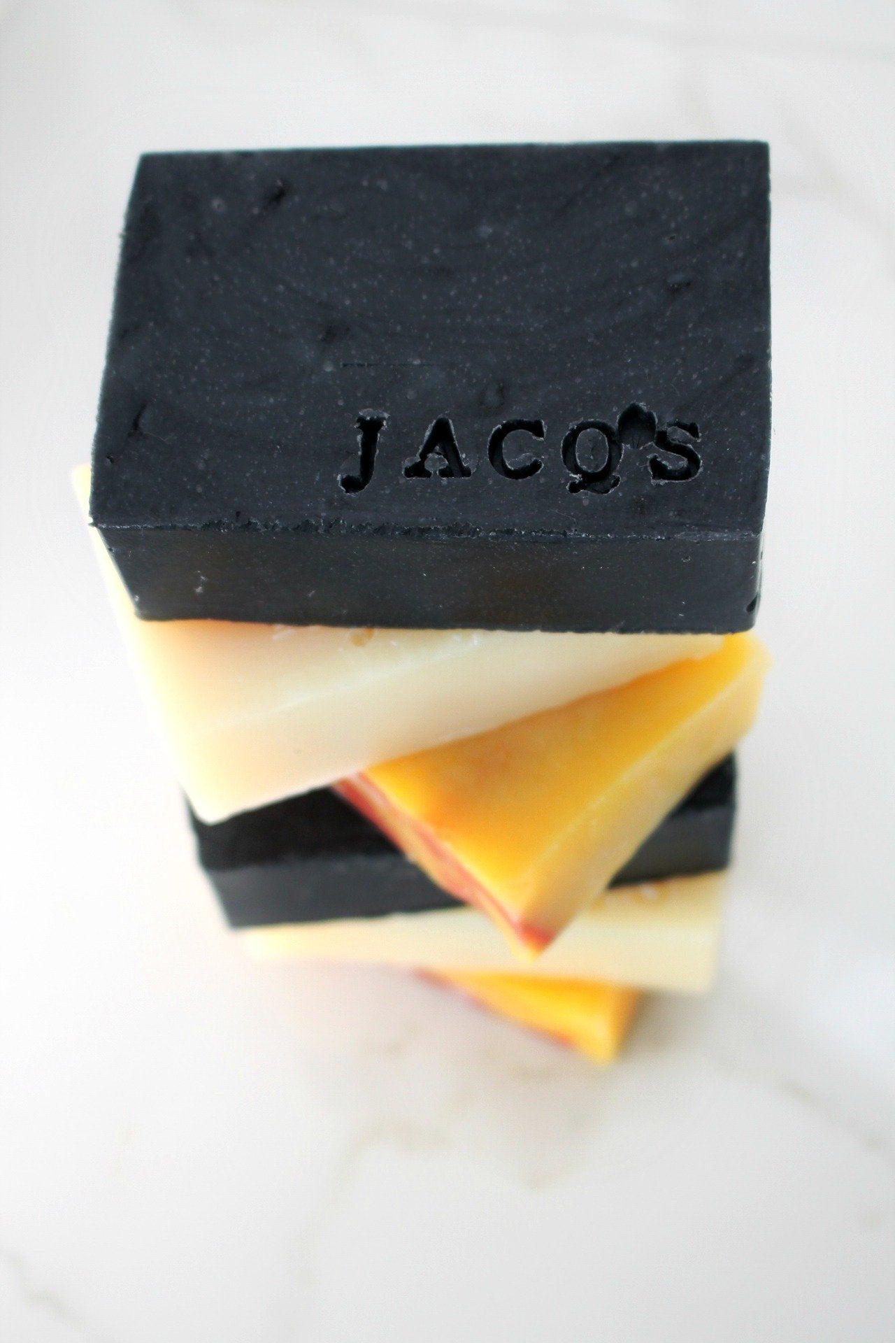 stack of JACQ's organic beauty bars